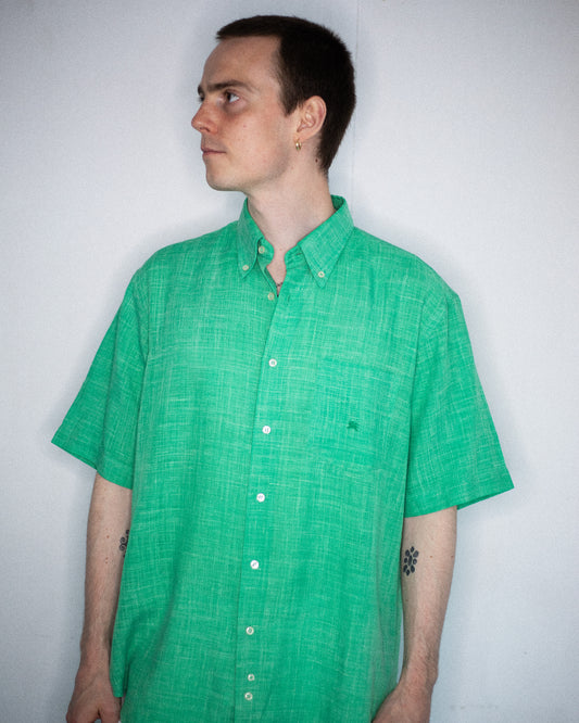 Model wearing Burberry green short sleeve shirt from front view