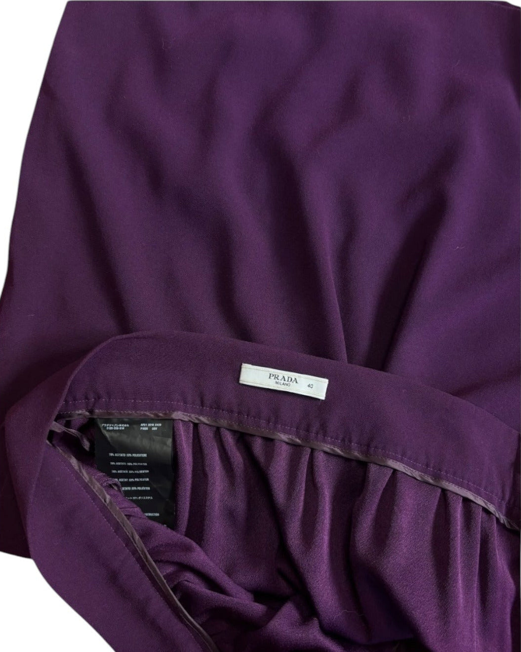 Close-up of Prada skirt label and pocket detail