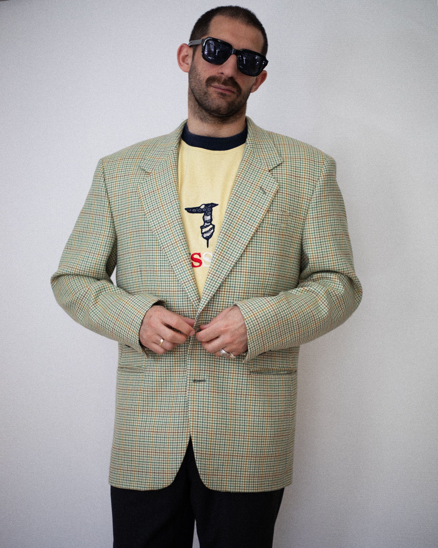Model wearing Valentino blazer buttoned up, front view