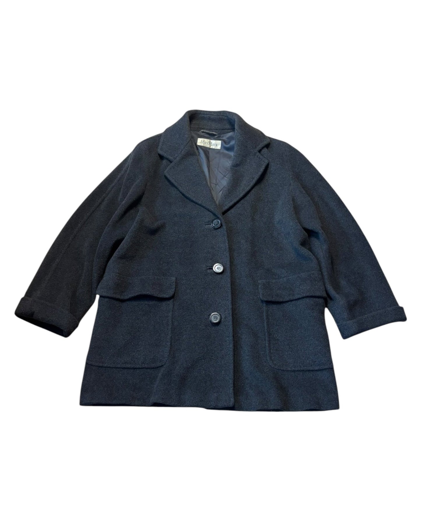 Flat lay of vintage Max Mara short wool jacket with patch pockets