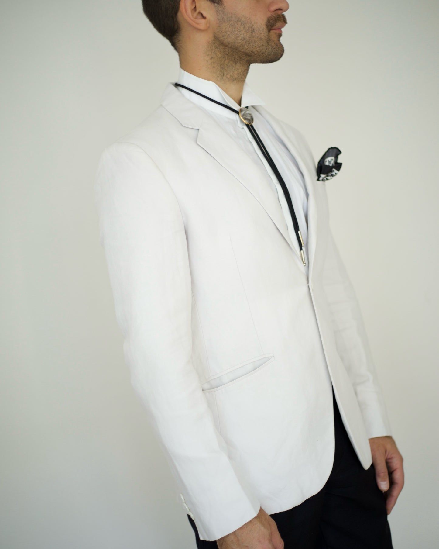 Side view of 1990s Emporio Armani blazer in linen with slim waist and structured shoulder, size S