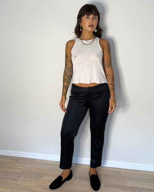 Model wearing Blumarine low-rise pants with tank top and flats