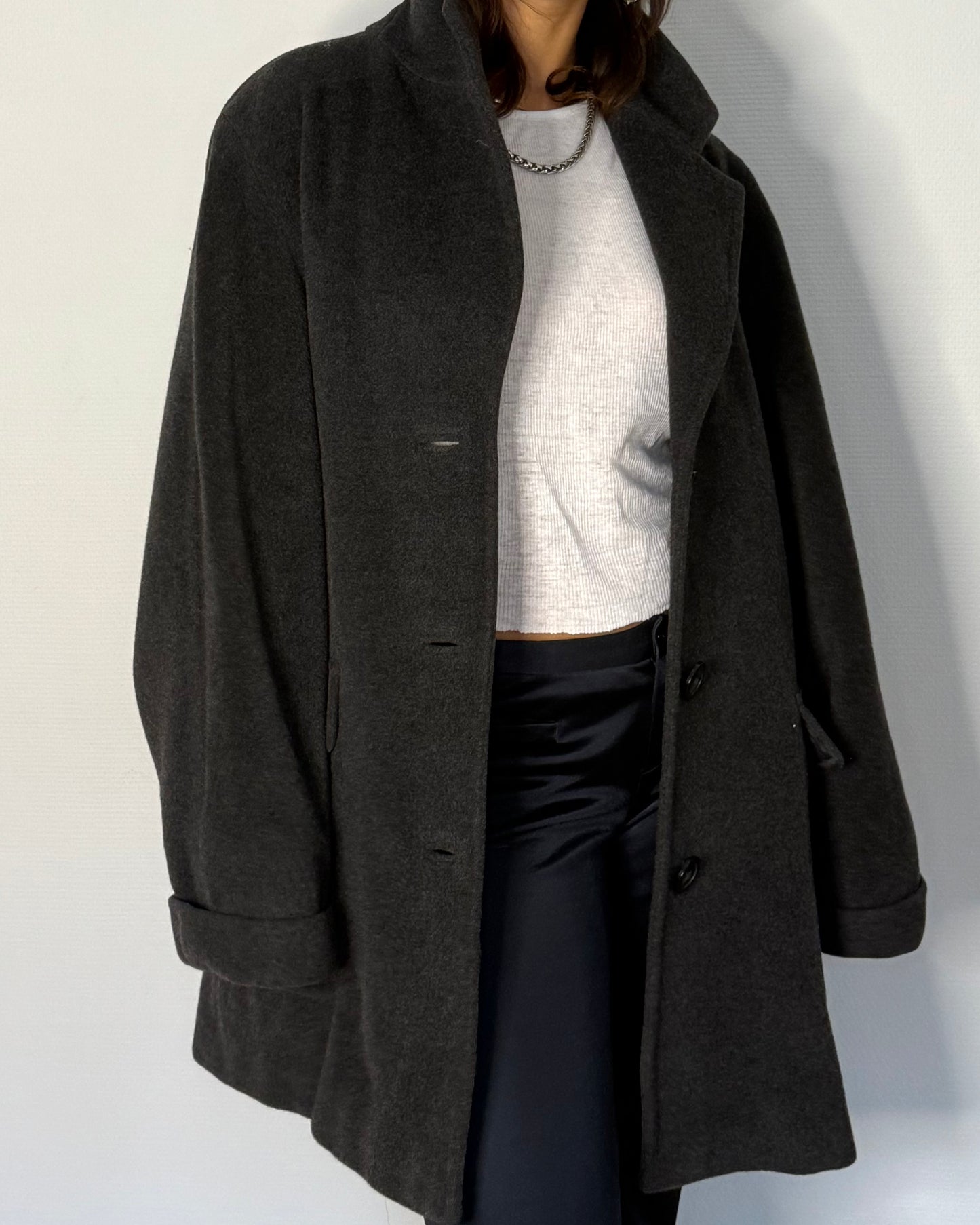 Front view of boxy Max Mara wool coat worn open over white shirt