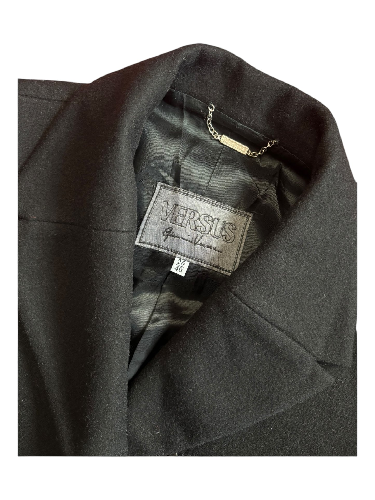 Close-up of Versace overcoat label and collar stitching