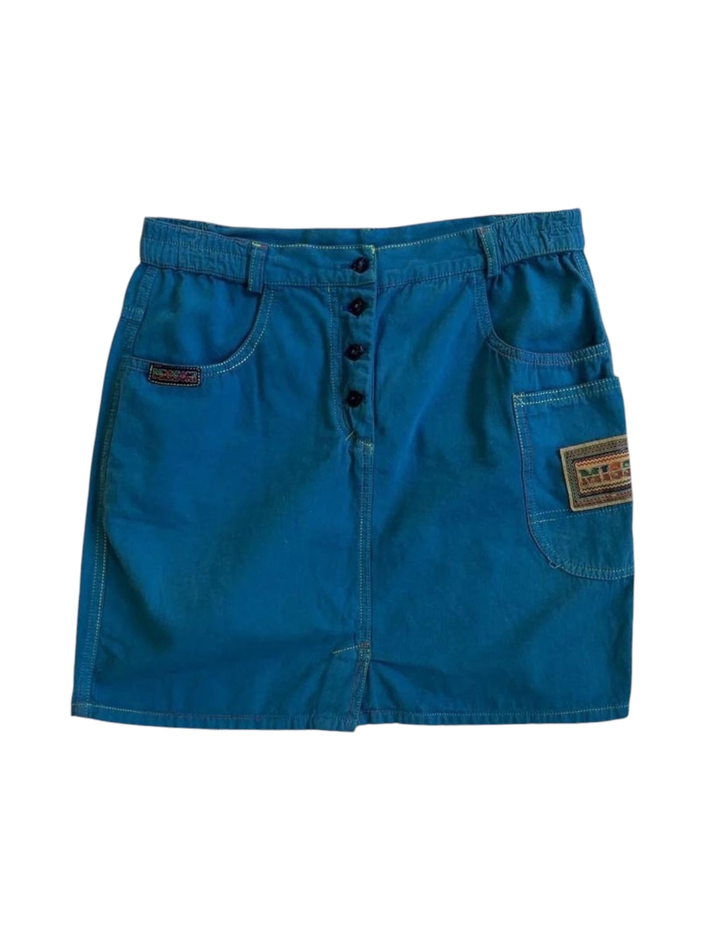 Model wearing 1990s Missoni electric blue cotton mini skirt with utility pockets and logo patch