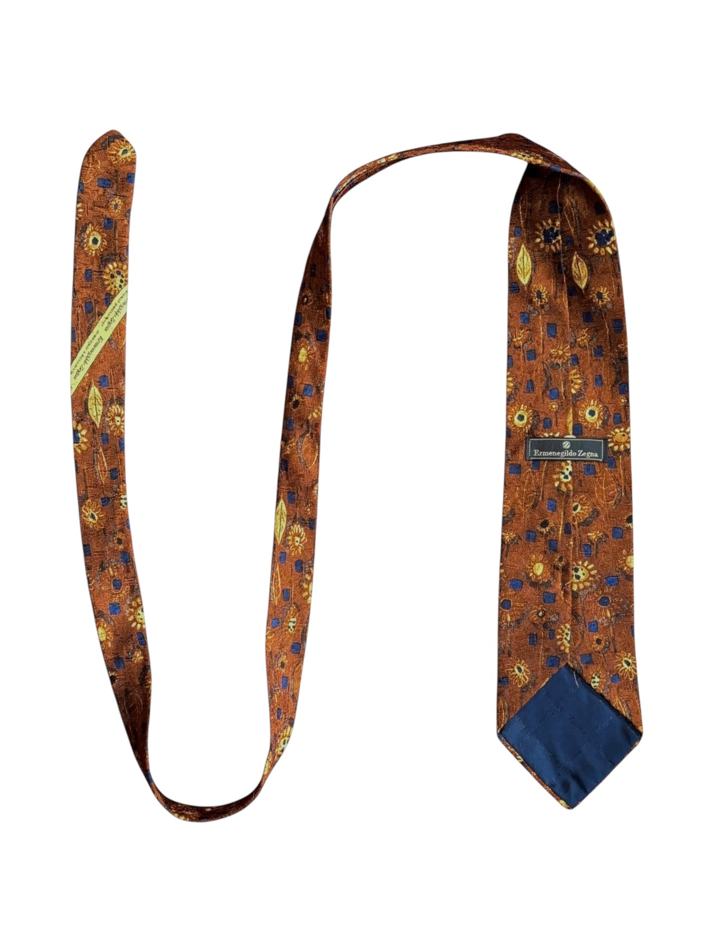 Close-up of the Ermenegildo Zegna tie showing copper, navy, and brown pattern