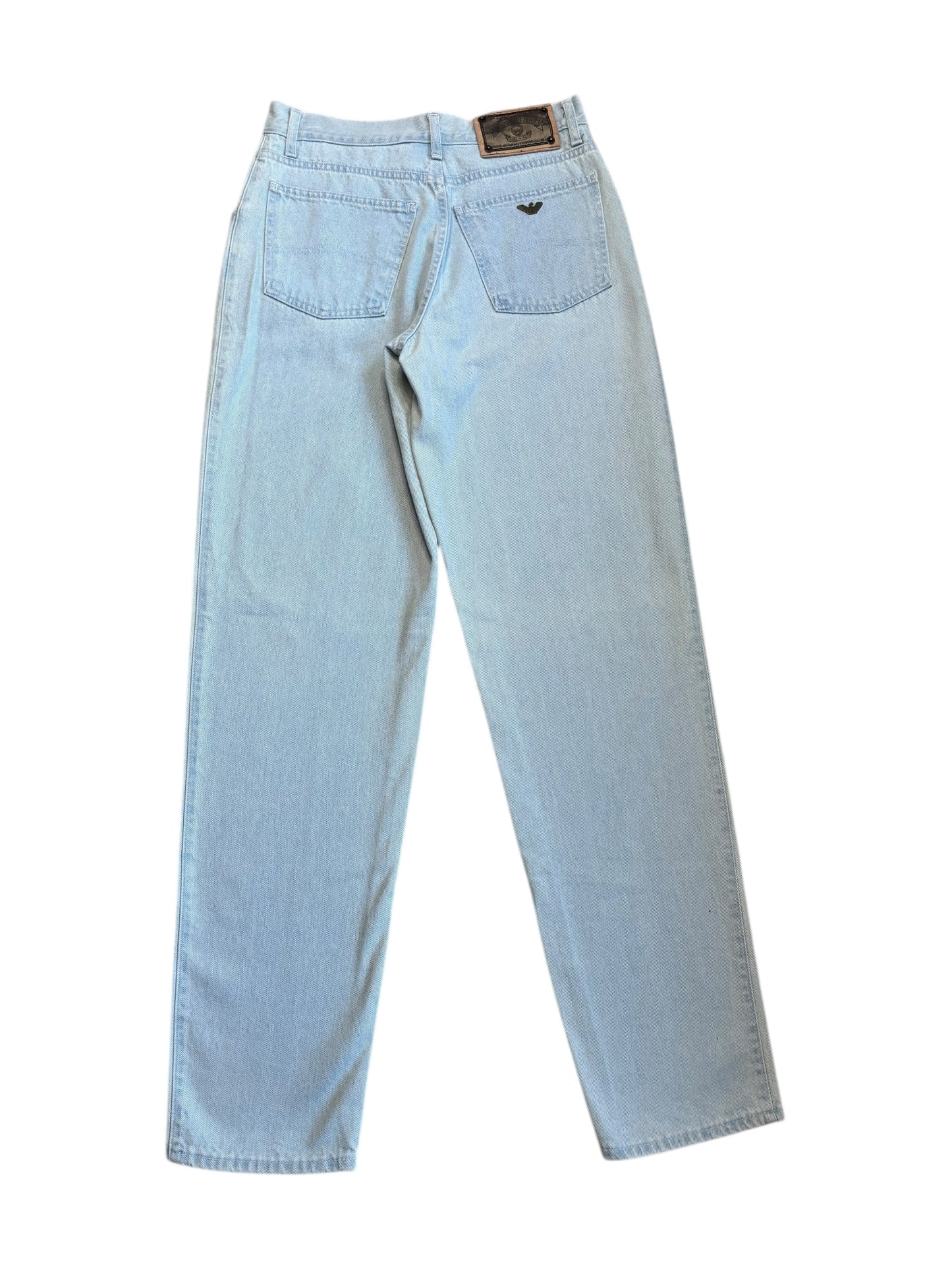 A pair of light blue, slightly tapered, faded wash Armani jeans with belt loops and pockets visible.