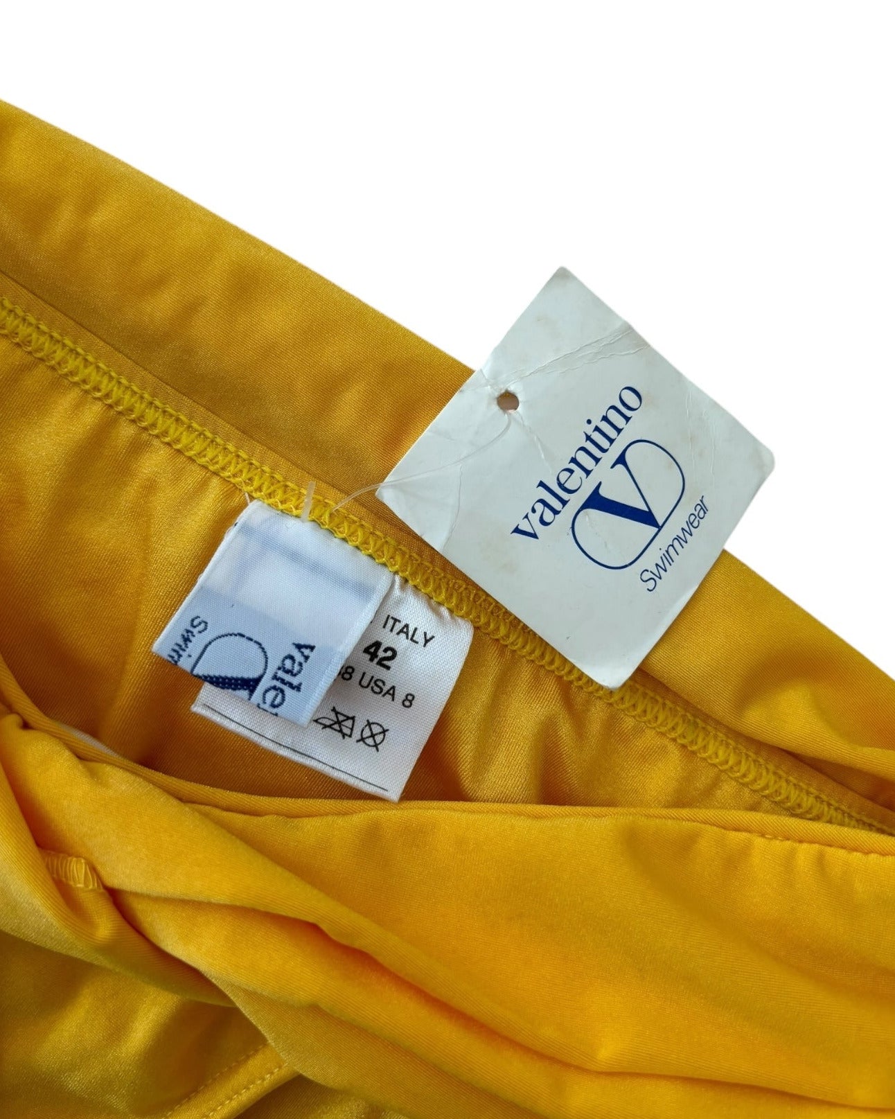 1990s deadstock Valentino two-piece bikini in bold yellow. Made in Italy. Rare vintage swimwear in size S/M with original tags.