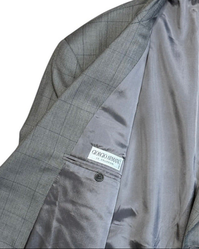 Gray checkered suit jacket with Giorgio Armani brand label on a white background