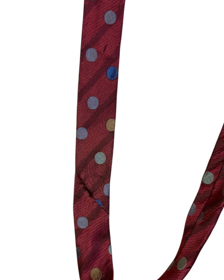 Red necktie with multicolored polka dots on a white background