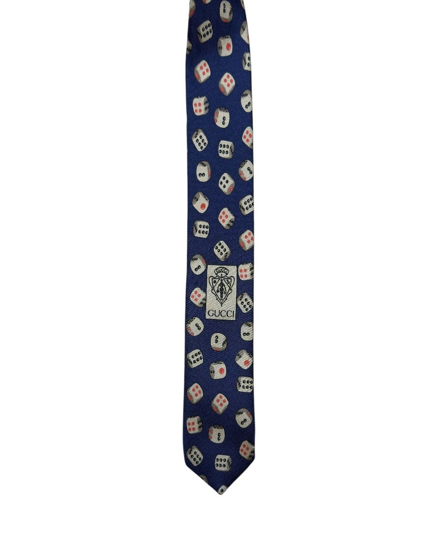Navy blue tie with dice pattern on a white background