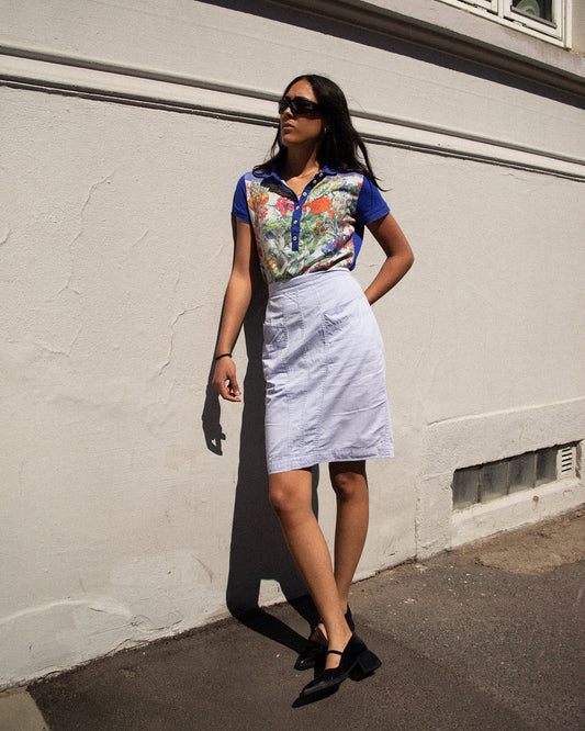 Model wearing Fendi lilac skirt with heels, front view