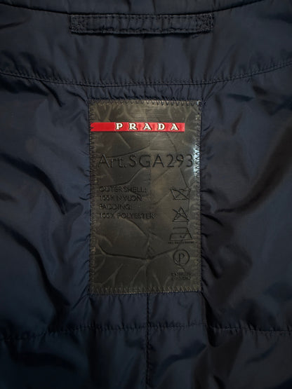 Close-up of a Prada label on a dark jacket