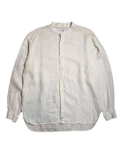 A light beige CP Company linen long-sleeve button-up shirt with a mandarin collar, laid flat against a white background.