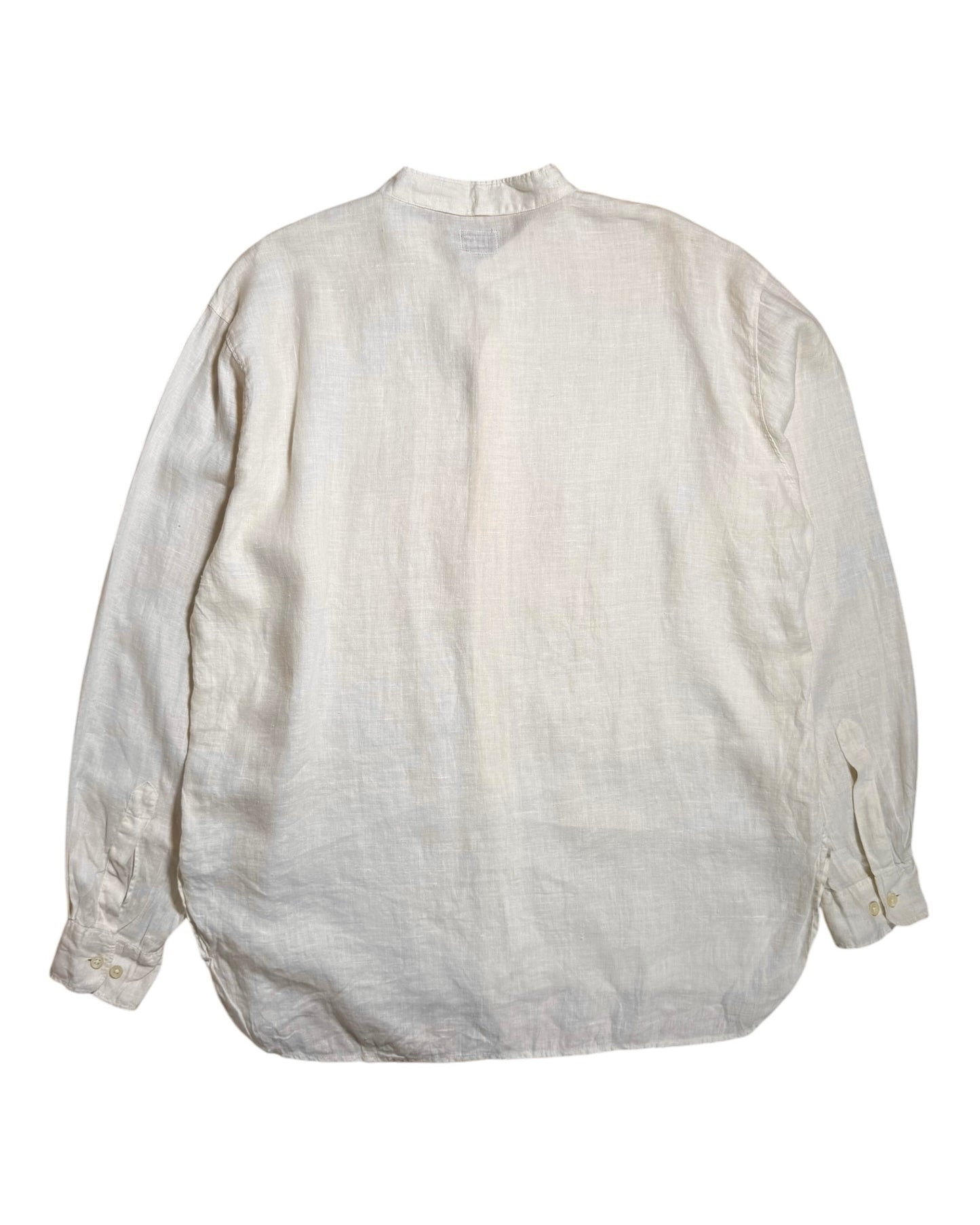 An off-white, textured linen CP Company long-sleeve shirt shown from the back, laid flat against a solid white background.