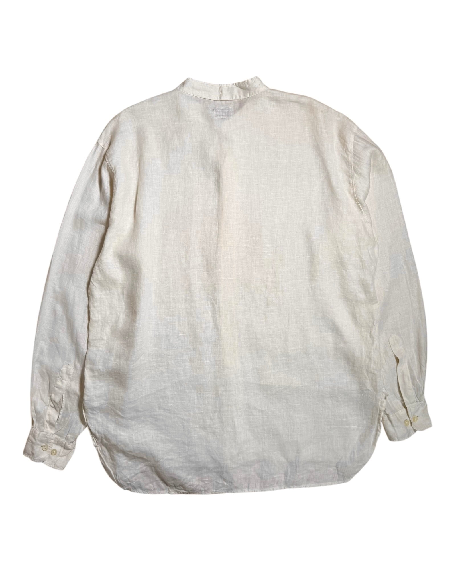 An off-white, textured linen CP Company long-sleeve shirt shown from the back, laid flat against a solid white background.