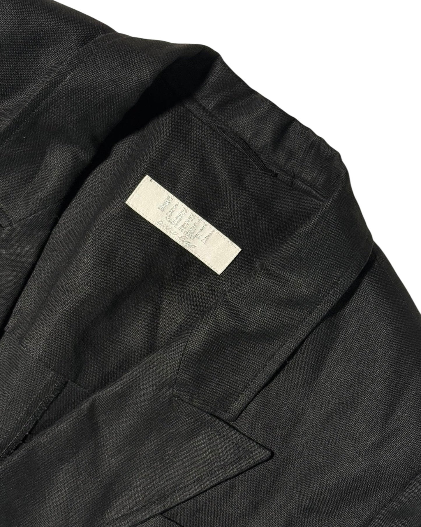 Black jacket with a Marella brand label on a white background
