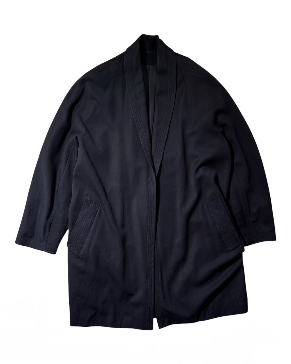 A MaxMara navy shawl collar kimono-style jacket with three-quarter sleeves and ribbed welt pockets, laid flat against a white background.