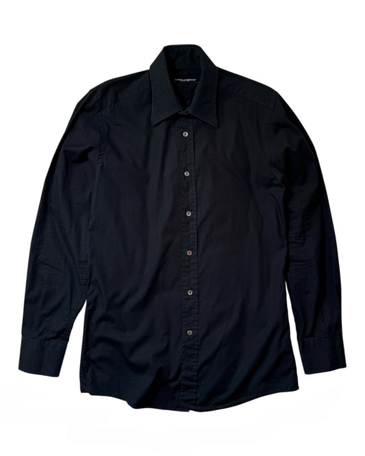 A long-sleeve Dolce & Gabbana button-down shirt in solid black, laid flat against a white background.