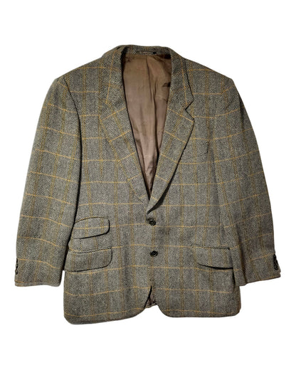 A men's two-button vintage valentino blazer in a brown and beige herringbone tweed with a subtle yellow windowpane check pattern, shown against a plain white background.