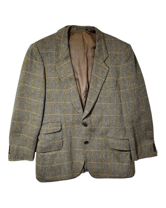 A men's two-button vintage valentino blazer in a brown and beige herringbone tweed with a subtle yellow windowpane check pattern, shown against a plain white background.