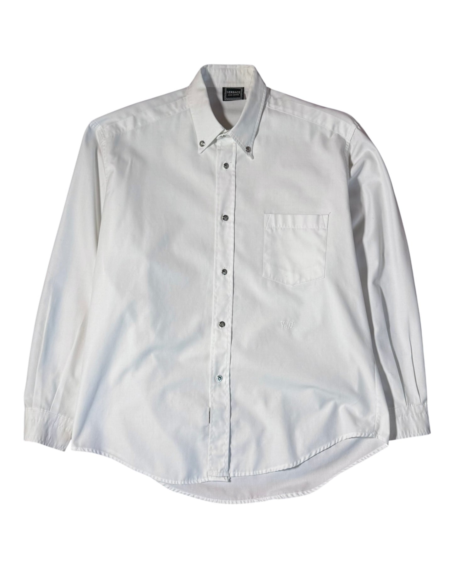 White button-up versace shirt on a white background