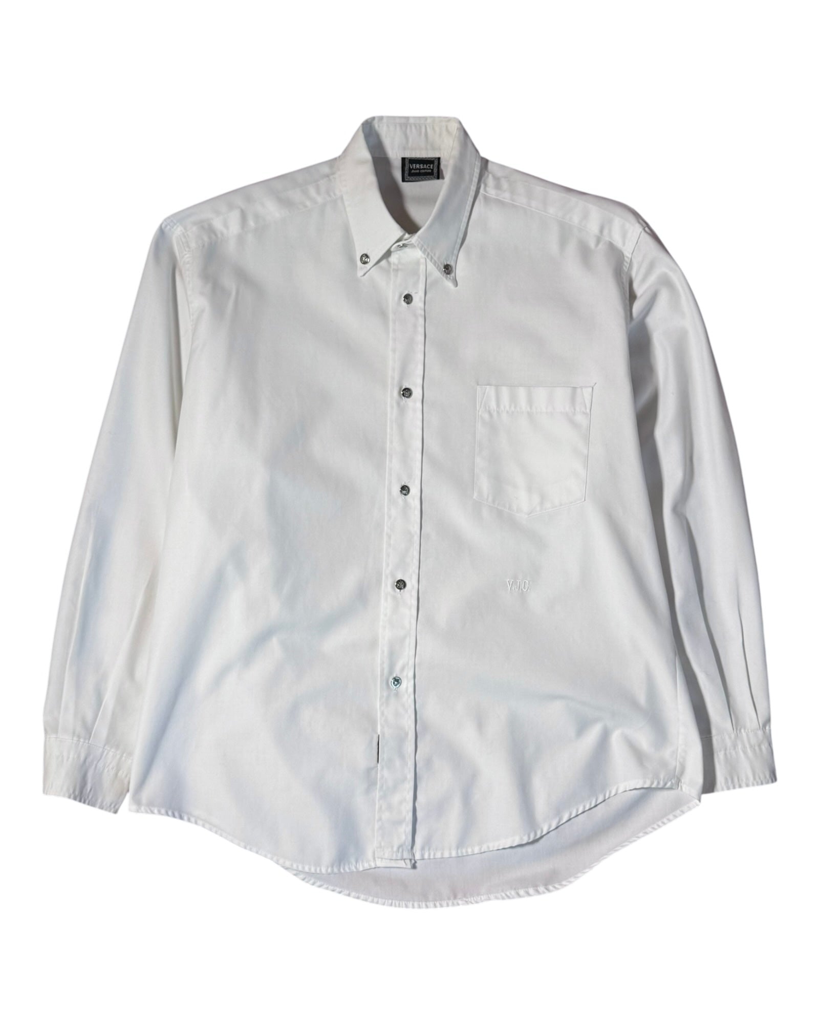 White button-up versace shirt on a white background