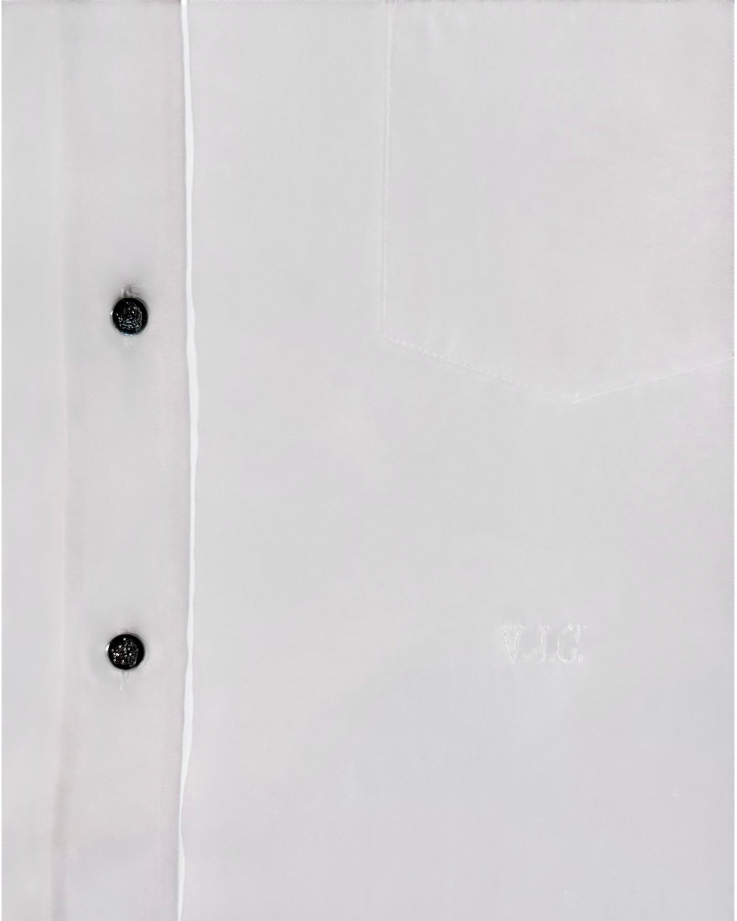 White shirt with silver buttons on a white background