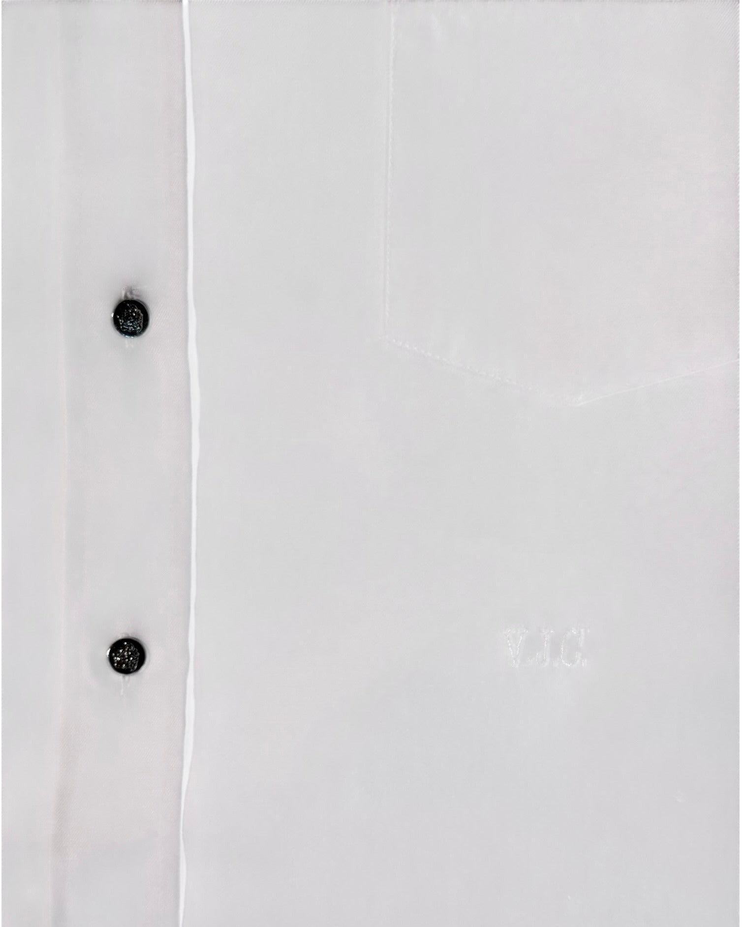 White shirt with silver buttons on a white background