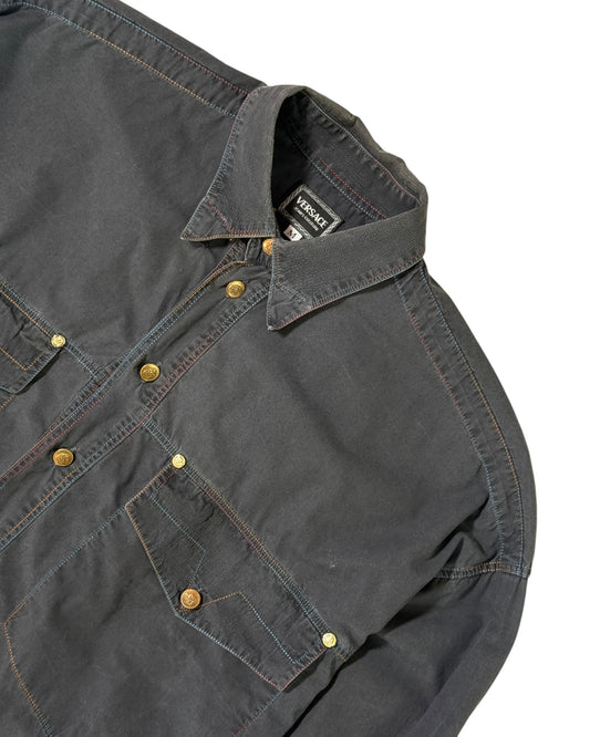 Dark gray versace shirt with button details on a white background