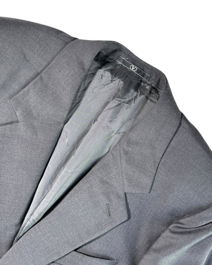 Valentino suit jacket with a close-up of the collar and label on a white background