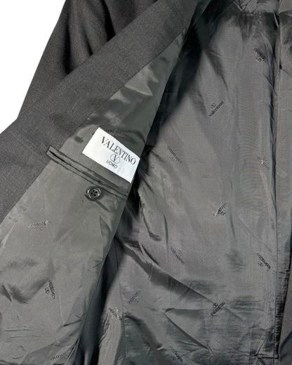 Gray jacket with a Valentino label on a white background