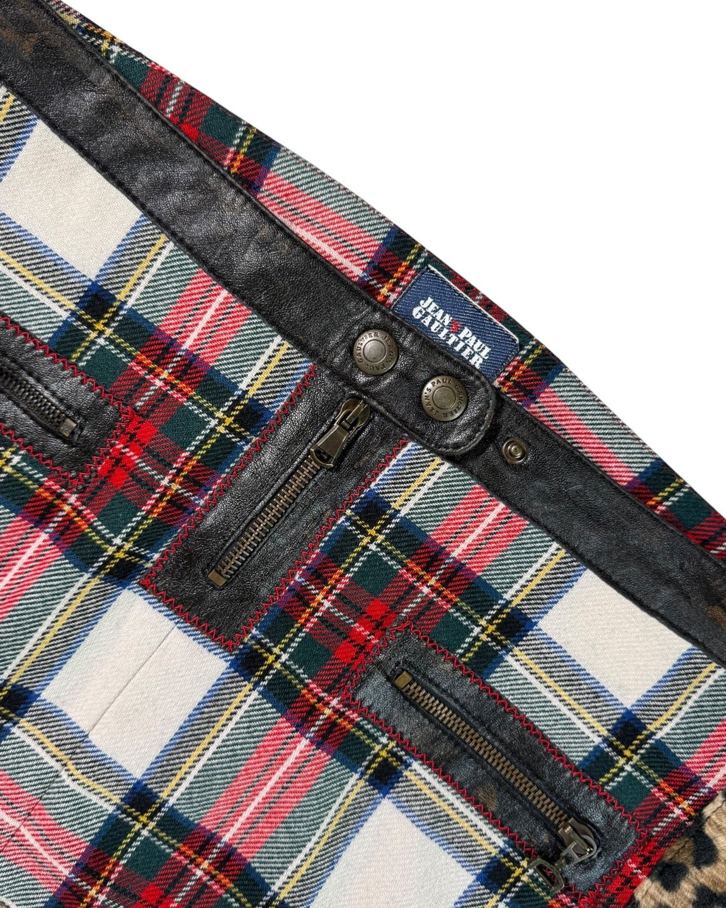 Jean Paul Gaultier laid fabric with leather trim on a white background