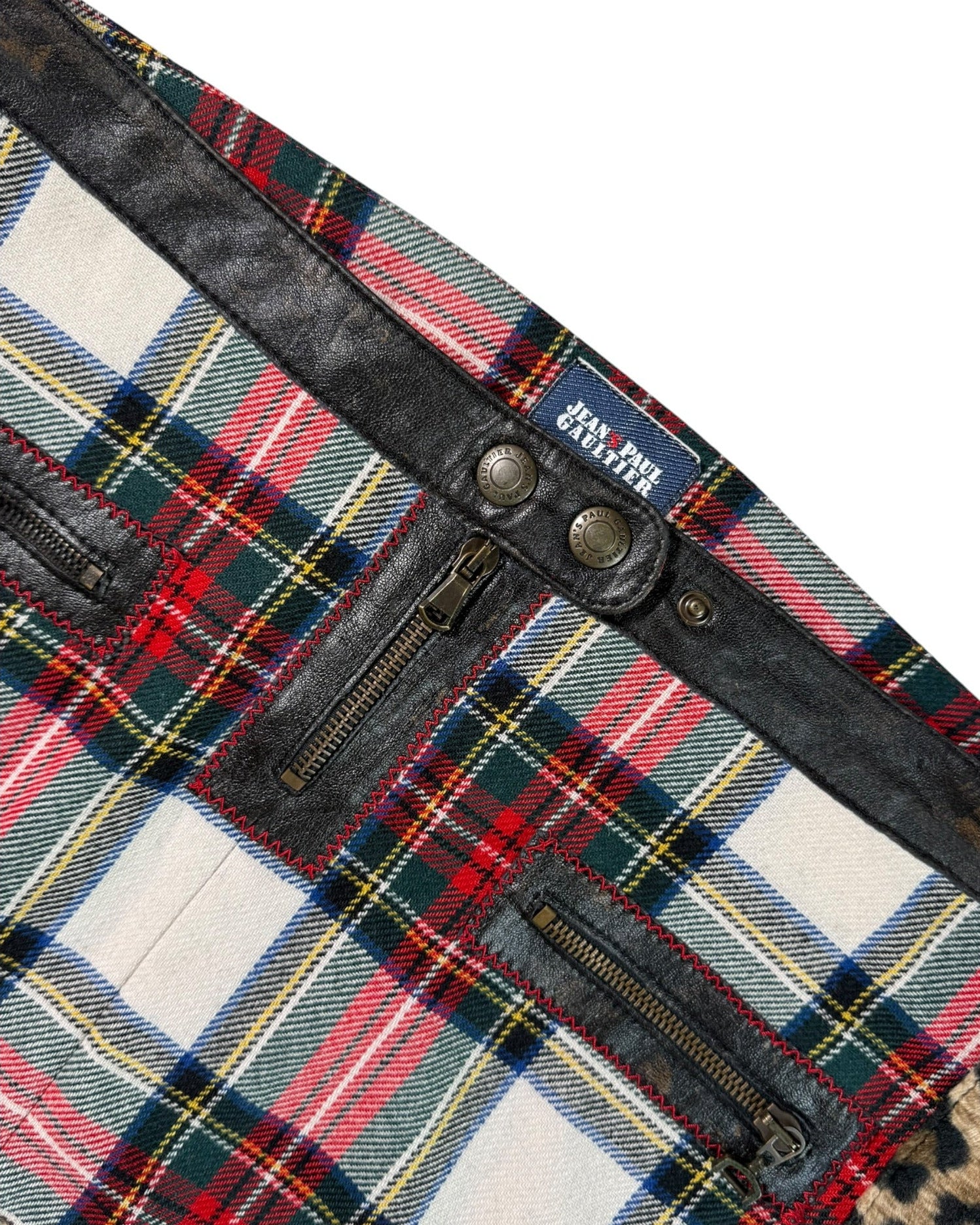 Jean Paul Gaultier laid fabric with leather trim on a white background