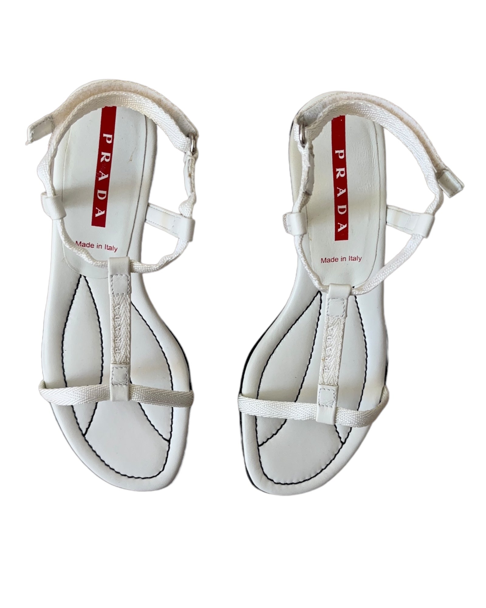 Vintage Prada Linea Rossa white strappy kitten heel sandals with red tab logo, size 37.5, shown against white background.