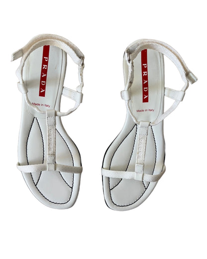 Vintage Prada Linea Rossa white strappy kitten heel sandals with red tab logo, size 37.5, shown against white background.