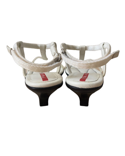 Vintage Prada Linea Rossa white strappy kitten heel sandals with red tab logo, size 37.5, shown against white background.