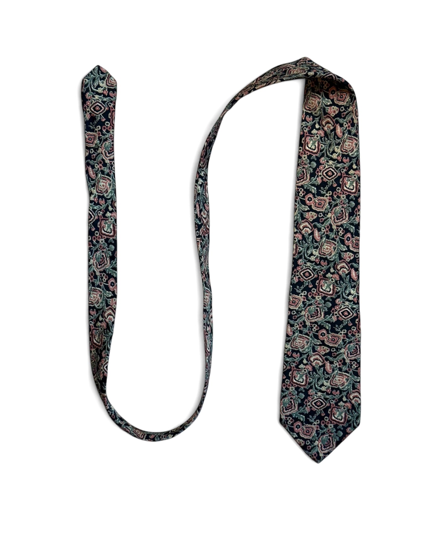 Close-up of Ermenegildo Zegna vintage silk necktie with navy, blush, and green floral geometric pattern.