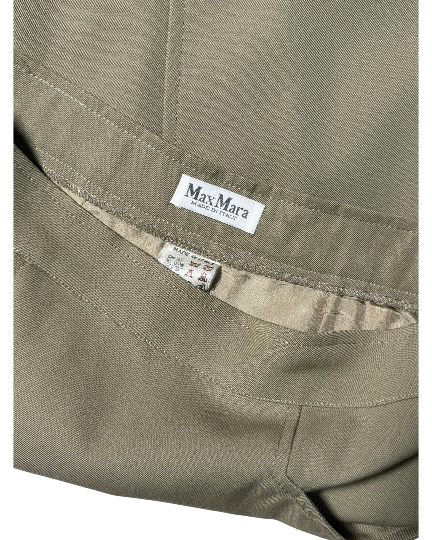 Close-up of a Max Mara label on a piece of fabric.