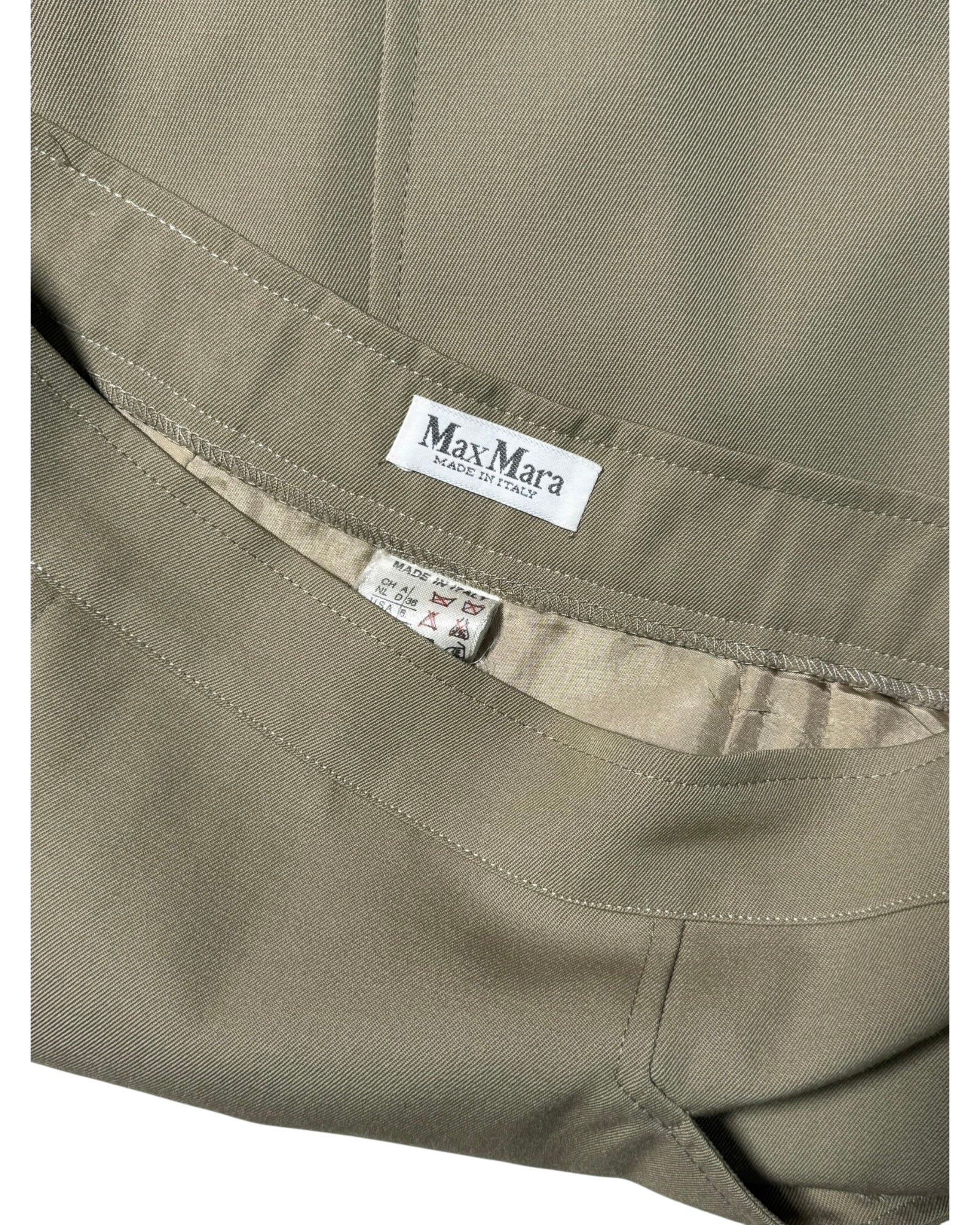 Close-up of a Max Mara label on a piece of fabric.