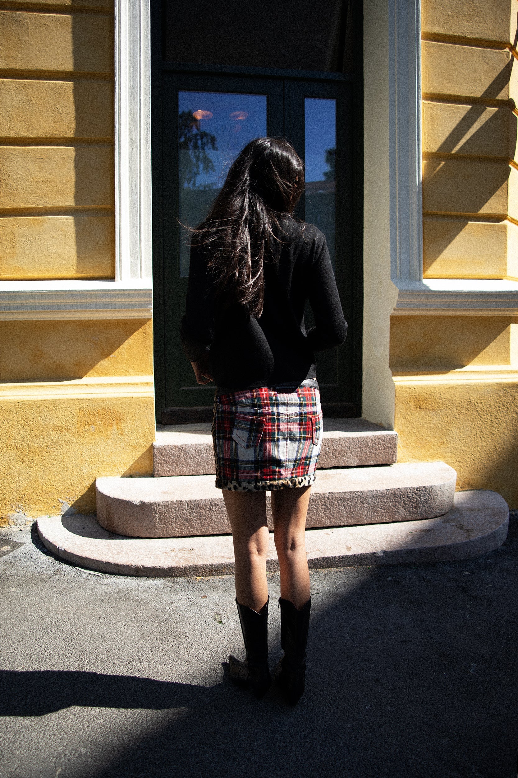 Model wearing Jean Paul Gaultier plaid skirt